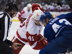 Detroit Red Wings Luke Glendening faces off against Toronto Maple Leafs Nazem Kadril during third period NHL action in Toronto on Saturday, October, 3, 2015. THE CANADIAN PRESS/Aaron Vincent Elkaim