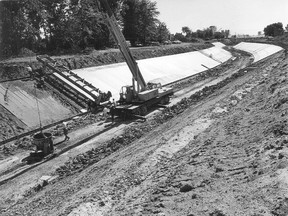 Crews pour concrete along the Grand Marais Drain east of Huron Church Road in August 1971. The city and ERCA have launched a $1.1-million improvement project.