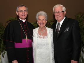 TECUMSEH, ON. OCTOBER 29, 2015. Bishop Ronald Fabbro (L) poses with Joan and Ed Bachynski, honorary co-chairs of the annual Bishop's Dinner held Thursday, Oct. 29, 2015, at the Ciociaro Club in Tecumseh, ON. (DAN JANISSE/The Windsor Star)