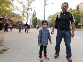 Oscar Marquez,  and his son Gilberto, 4, are shown in front of General Brock Public School on Tuesday, Oct. 6, 2015. Marquez was shocked to hear about the cockroach situation that closed the cafeteria recently.