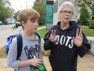 Brooklyn Nugent, 10, a grade 6 student at General Brock Public School and her grandmother Kelly Aquene are shown Tuesday, Oct. 6, 2015, in front of the school. They were commenting on the cockroach situation that closed the cafeteria recently. (DAN JANISSE/The Windsor Star) (For story by Carolyn Thompson)