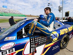 Chase Elliott, driver of the #9 NAPA Auto Parts Chevrolet, climbs into his car during qualifying for the NASCAR XFINITY Series Kansas Lottery 300 at Kansas Speedway on October 17, 2015 in Kansas City, Kansas. (Photo by Matt Sullivan/Getty Images)