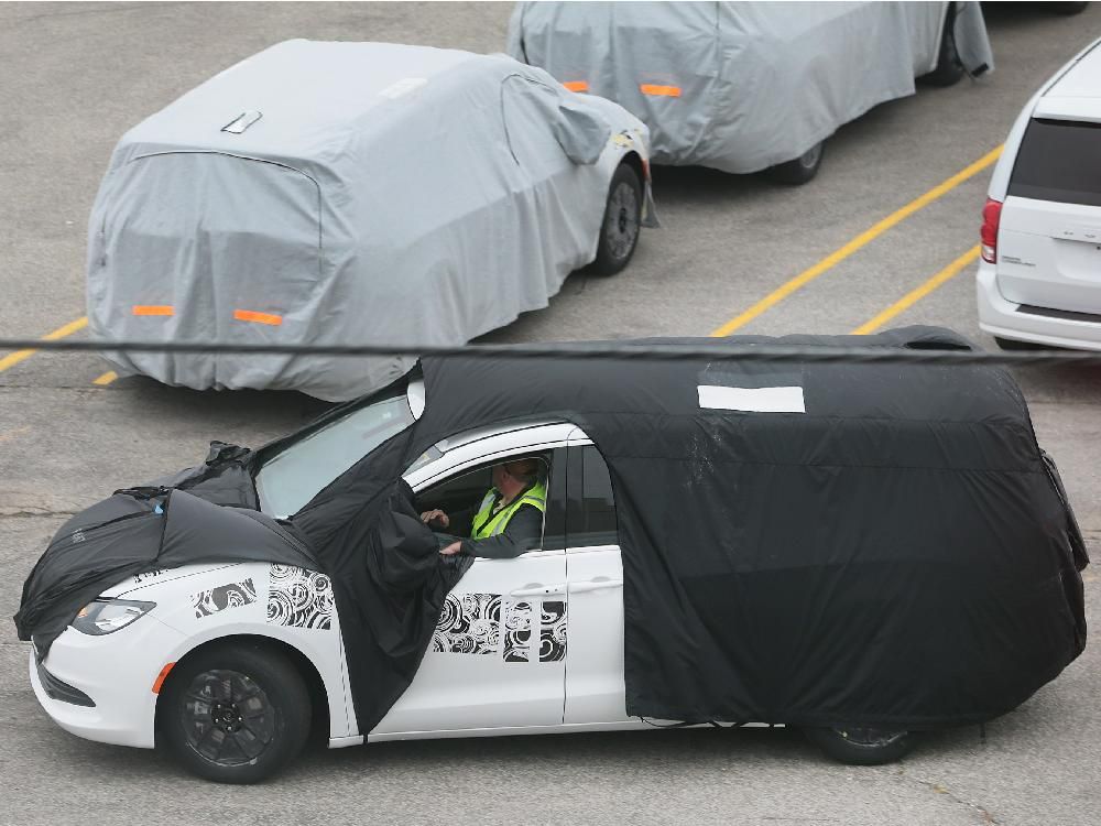 New Chrysler minivan shrouded in secrecy, and tarps, on WAP lot