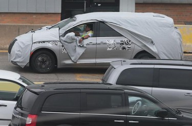 WINDSOR, ON. OCTOBER 6, 2015- A blanketed minivan is moved at the Fiat Chrysler Automotive's Windsor Assembly Plant on Oct. 6, 2015.