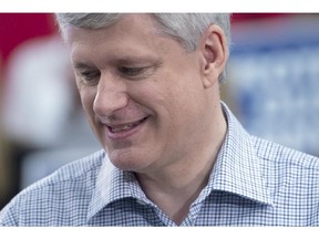 Conservative Leader Stephen Harper pauses for a moment as he attends a campaign event at William F. White International in Etobicoke, Ont., Tuesday, Oct. 13, 2015.