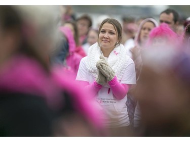 Alexia Rimbert listens as survivors speak during the ceremony at the Canadian Breast Cancer Foundation CIBC Run for the Cure at the Riverfront Festival Plaza, Sunday, Oct. 4, 2015.  (DAX MELMER/The Windsor Star)