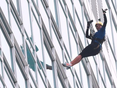 Windsor Star reporter Kelly Steele rappels down the Caesars Windsor Augustus Tower during the 3rd annual Easter Seals Drop Zone in Windsor, Ontario.