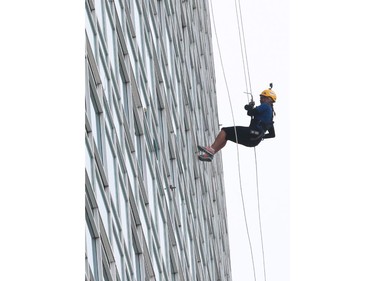 Windsor Star reporter Kelly Steele rappels down the Caesars Windsor Augustus Tower during the 3rd annual Easter Seals Drop Zone in Windsor, Ontario. (DAN JANISSE/The Windsor Star)