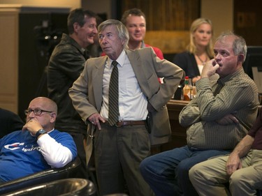 Jeff Watson supporters watch as results come at Pointe West Golf Club in showing Tracey Ramsey defeating the incumbent Jeff Watson   in the riding of Essex, Monday, Oct. 19, 2015.