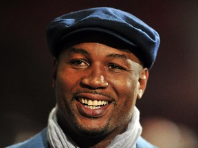 Former Heavyweight boxer Lennox Lewis attends the English Premier League football match between West Ham United and Norwich City at Upton Park in London on February 11, 2014.