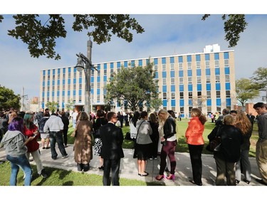 City of Windsor workers and members of the public gather outside of City Hall on Monday, Oct. 5, 2015 for the kick-off of fire prevention week. Both the 350 and 400 City Hall Square buildings were emptied for the occasion after fire alarms where pulled in both buildings by the mayor and CAO of the city.   (DAN JANISSE/The Windsor Star)