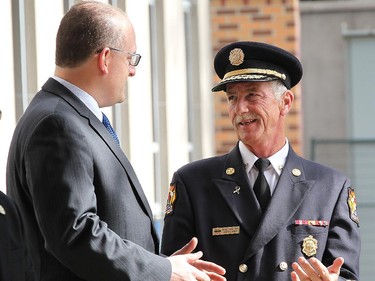 Windsor mayor Drew Dilkens (L) and Windsor Fire and Rescue Services Chief Bruce Montone chat during a media conference for the kick-off of fire prevention week on Monday, Oct. 5, 2015 at the City Hall. (DAN JANISSE/The Windsor Star)