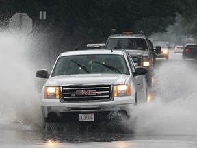 A truck drives through a flooded section of California Avenue after heavy rains hit the area in this 2014 file photo.