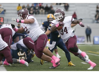 McMaster's Wayne Moore rushes for a touchdown as the Windsor Lancers host the McMaster Marauders during OUA football action at Alumni Field, Saturday, Oct. 3, 2015.  (DAX MELMER/The Windsor Star)