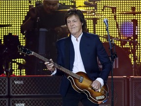 British musician and former Beatles' member Paul McCartney performs on June 11, 2015 at the Stade de France in Saint-Denis near Paris. McCartney will play Detroit's Joe Louis Arena on Wednesday, Oct. 21.