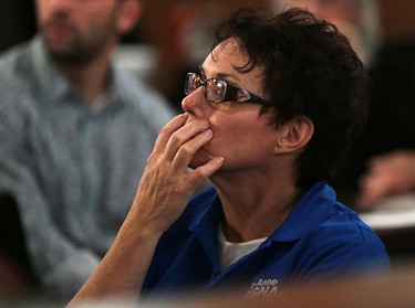 A conservative supporter of Jo-Anne Gignac watches results come in on television on Oct.19, 2015 in Windsor, Ont.