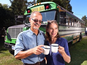 Felix Winkelaar and Cindy Cooper pose in front of their Green Bus which is a equipped with a fully functional commercial kitchen and coffee roaster. (DAN JANISSE/The Windsor Star)