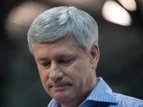 Conservative leader Stephen Harper pauses for a moment as he attends a campaign event in Quebec City on Friday, Oct. 16, 2015. Canadians will go to the polls in the Federal election Oct. 19.