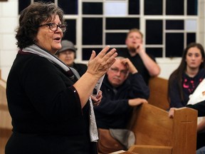 Julia Burgess talks with concerned residence during a information session about the closure of Harrow High School in Harrow on Monday, Oct. 26, 2015.