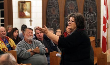 Julia Burgess talks with concerned residence during a information session about the closure of Harrow High School in Harrow on Monday, Oct. 26, 2015.