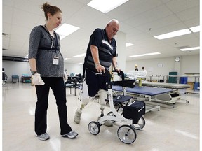 WINDSOR, ONTARIO, SEPT. 24, 2015 - Rick Reaume, 70, says the health care system works well for him and he wants new government to keep it that way. He lost both legs and five fingers to complications from diabetes. He is shown during a physiotherapy session on Thursday, Sept. 24, 2015, at the Hotel-Dieu Grace Healthcare facility in Windsor, ON. (DAN JANISSE/The Windsor Star)