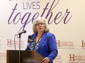 Hotel-Dieu Grace Healthcare president and chief executive officer Andrea Drummond talks about the partnership with Hospice of Windsor and Essex County for volunteer services including the Burden Bear program, vigil volunteers and Hospice traditions such as the honour guard during a press conference on Oct. 28, 2015.