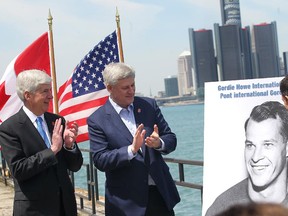 WINDSOR, ON. MAY 14, 2015.  Michigan Gov. Rick Snyder, left, Prime Minister Stephen Harper (C) and Murray Howe, Gordie Howe's son, announce that the Detroit River International Crossing will be named the Gordie Howe International Bridge, on the waterfront, in Windsor, ON., Thursday May 14, 2015.  (DAN JANISSE/The Windsor Star)