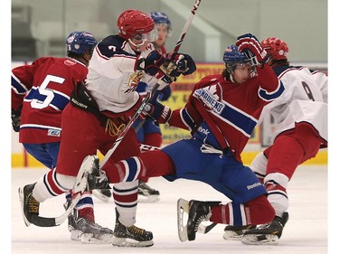 Alvinston's Cole Harris (L) and Lakeshore's JJ Percy collide during their game on Friday, Oct. 2, 2015, at the Atlas Tube Centre in Lakeshore, ON. (DAN JANISSE/The Windsor Star)