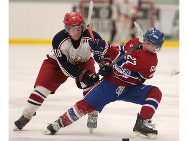 Alvinston's Brady Swan (L) and Lakeshore's Mejoe Gasparovic battle for the puck during their game on Friday, Oct. 2, 2015, at the Atlas Tube Centre in Lakeshore, ON. (DAN JANISSE/The Windsor Star)