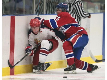Alvinston's Joe Stock (L) and Lakeshore's Connor Goodchild collide during their game on Friday, Oct. 2, 2015, at the Atlas Tube Centre in Lakeshore, ON. (DAN JANISSE/The Windsor Star)