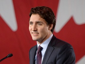 Liberal leader and incoming prime minister Justin Trudeau is seen on stage at Liberal party headquarters in Montreal early Tuesday, Oct. 20, 2015 after winning the 42nd Canadian general election.