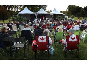 KINGSVILLE, ONTARIO- AUGUST 8, 2014 - The crowd takes in the inaugural Kingsville Folk Music Festival on Friday, August 8, 2014. The event runs all weekend at the Lakeside Park.  (DAN JANISSE/The Windsor Star)