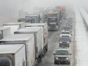 The eastbound lanes of Highway 401backed up during a snowy, windy day in Windsor.