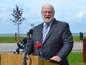 Leamington Mayor John Paterson talks about upgrades to the sanitary sewer system along Pelee Drive  on Tuesday, June 30, 2015, at Mersea Park on the shore of Lake Erie. Leamington will receive up to $4 million from the federal and provincial governments for the project.
