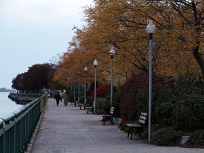 Several of the pathway lights along the riverfront trail fail to come on as the sun goes down over Windsor on Wednesday, October 21, 2015.