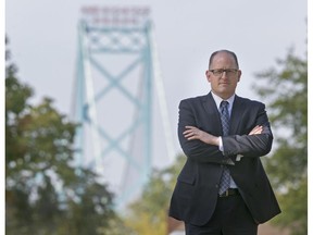 Mayor Drew Dilkens stands on Indian Road in front of the Ambassador Bridge on Oct. 8, 2015.