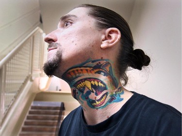 Joel Montfort, a tattoo artist from St. Thomas Ontario shows off some of his neck piece during the Motor City Tattoo Expo in Detroit, Mich. on Saturday, March 7, 2015. It was done by Belle River, Ont. artist John Wayne.