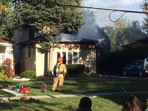 Windsor fire crews extinguish a blaze in the 1400 block of Norman Road on Saturday, Oct. 17, 2015.