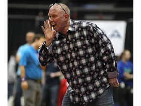 Tecumseh Vista coach Dave Hawkins gives direction to a team member during OFSAA wrestling championships at the WFCU Centre in Windsor, Ont. in this 2015 file photo.