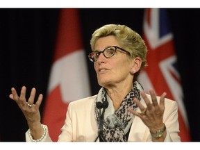 Ontario Premier Kathleen Wynne during a media availability at Queen's Park in Toronto, Thursday, Oct, 1, 2015.