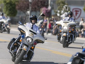 The OPP Golden Helmets Motocycle Precision Team perform on Tecumseh Rd. in Tecumseh, on Oct. 11, 2015.  The Golden Helmets were formed in 1963 and tour the province of Ontario giving exhibitions of their riding skill.