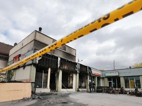 The scene of a fire at The Original Pizza Brothers on Wyandotte St. E. is shown on Tuesday, Oct. 13, 2015, in Windsor, Ont. Officials classified the fire as suspicious.