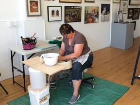 Lakeshore potter Gisele Bick works on her wheel at the Artspeak Gallery on Sept. 24, 2015. Bick is one of the participating artists in this year's Open Studio Tour. (Dalson Chen / The Windsor Star)
