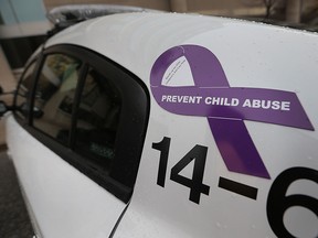 The Windsor Police Service and the Windsor-Essex Children's Aid Society are teaming up to promote the Go Purple campaign to prevent child abuse. Officers are wearing purple ribbons and cruisers have had the purple symbol place on them. A ribbon is shown on a cruiser on Wednesday, Oct. 28, 2015, in Windsor, Ont.