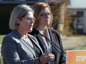 Provincial NDP leader Andrea Horwath (L) and Tracey Ramsey, federal candidate for the riding of Essex are shown during a media conference on Friday, Oct. 16, 2015, in front of the former Honeywell plant in Amhertsburg, Ont.