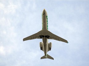 An Air Canada Jazz Air plane flies overhead in this 2009 file photo.