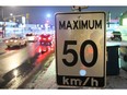 A 50-km/hr speed limit traffic sign.