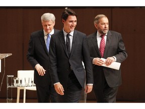 Liberal Leader Justin Trudeau, left to right, Conservative Leader Stephen Harper and NDP Leader Tom Mulcair leave the stage following the Munk Debate on Canada's foreign policy in Toronto, on Monday, Sept. 28, 2015.