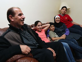 Muftakher Al Hayik and his wife Lina Alnatour are joined by their children Shahed, Osama and Omar (left to right) as they speak about their journey from Syria to Windsor at their home in Windsor on Tuesday, October 27, 2015.