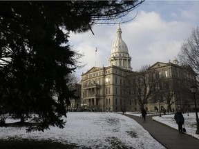 The Michigan State House is seen in Lansing, Mich., Wednesday, Jan. 9, 2013. As new members of the Legislature are sworn in on a day of pomp, the tone for 2013 could be set in part by two early developments, do Republicans object to the sitting of a Detroit Democrat with a criminal past and do Democrats vote against Jase Bolger's new term as House speaker.